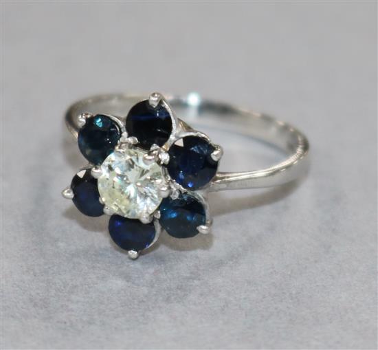 An 18ct white gold sapphire and diamond flowerhead cluster ring size M